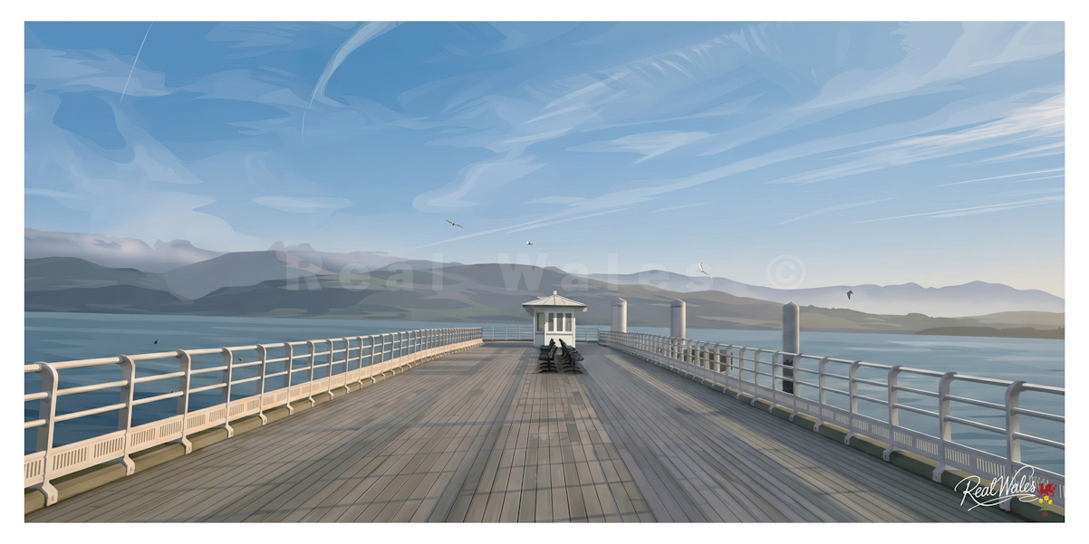 Stepping away from the elegant, pastel-colored Georgian and Victorian facades of Beaumaris's seafront, the town's historic pier reaches out into the fast-flowing waters of the Menai Strait. Originally built in 1846 to welcome grand steamships dropping off summer holidaymakers, the pier retains a deeply nostalgic, nautical charm. Its traditional wooden decking and ironwork pavilions offer a gentle, creaking contrast to the imposing, moat-ringed stone walls of the nearby Beaumaris Castle.