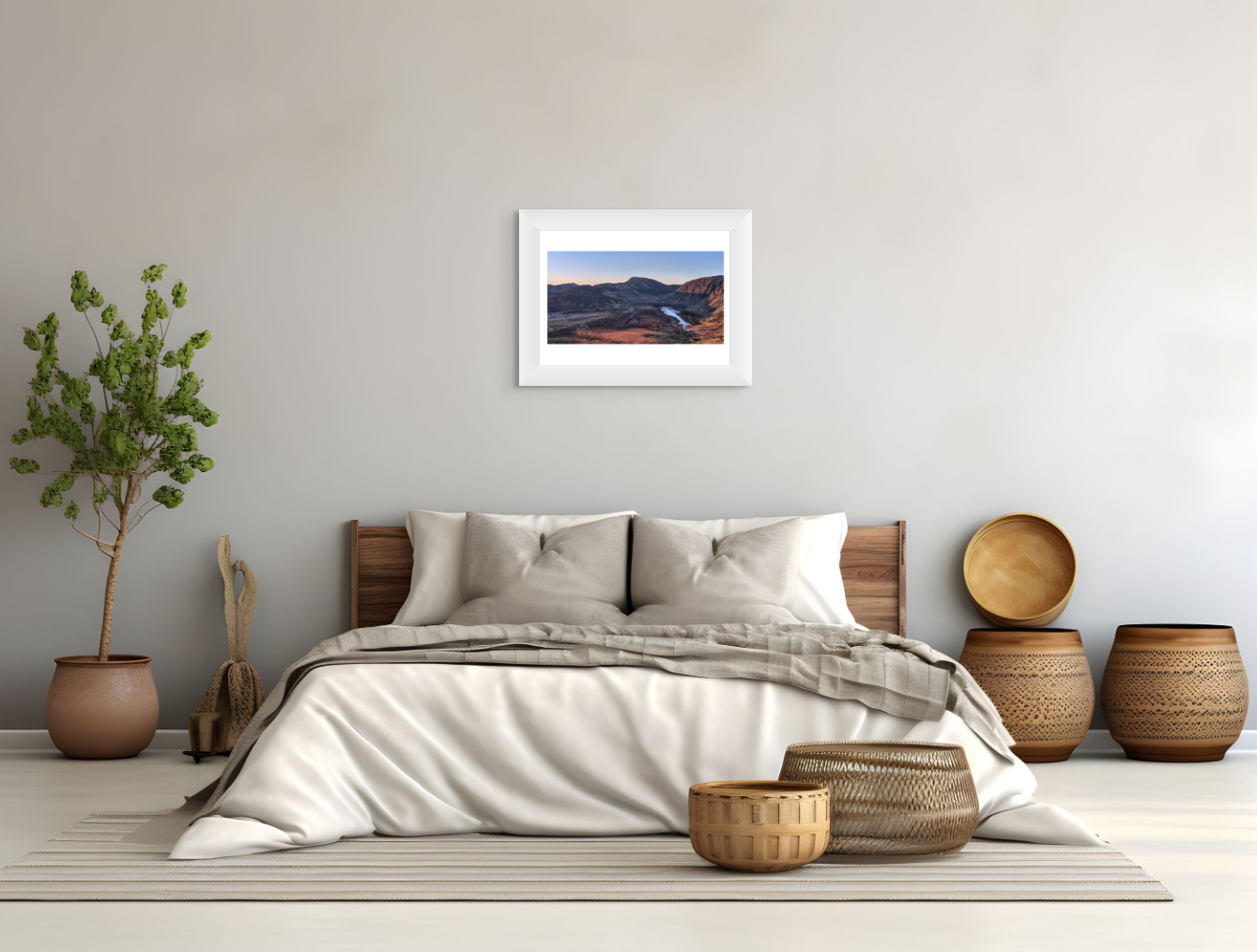 Bedroom with a bed, decorative baskets, and a framed picture on the wall.