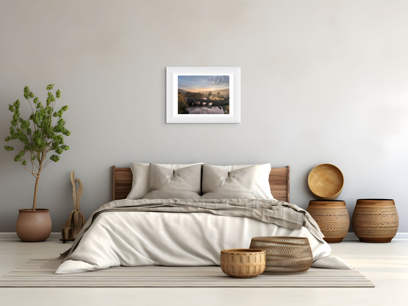 Bedroom with a bed, decorative baskets, and framed artwork on the wall.