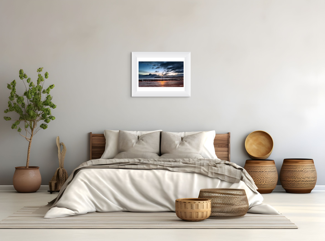 Bedroom with a bed, decorative baskets, and a framed picture on the wall.