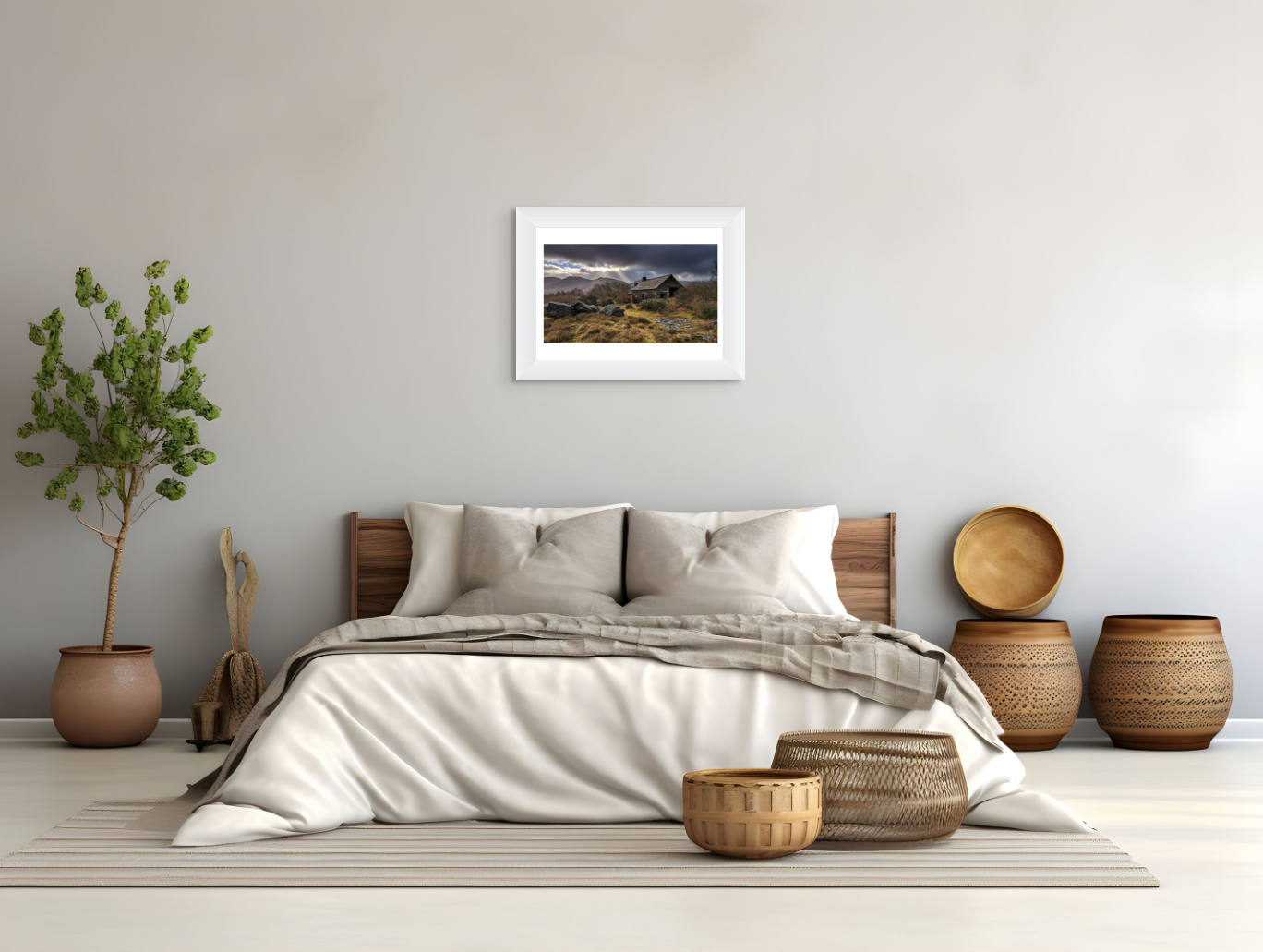 Bedroom with a bed, decorative baskets, and a framed landscape print on the wall.