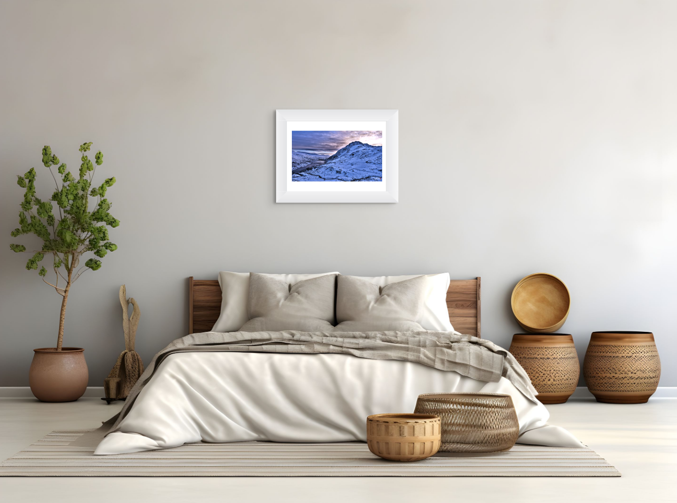 Bedroom with a bed, decorative baskets, and a framed picture on the wall.