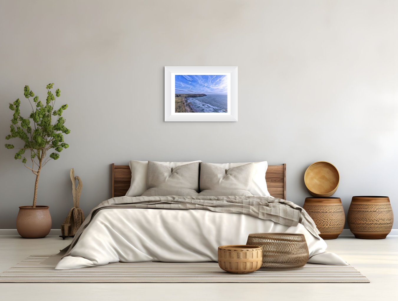Bedroom with a bed, decorative baskets, and a framed picture on the wall.